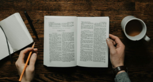 Child learning with a Christian tutor, using scripture to enhance understanding of school subjects.